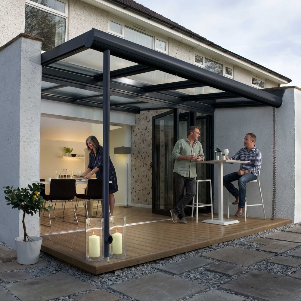 Black aluminium bifold doors opening onto a covered patio